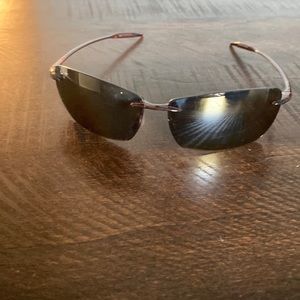 Maui Jim sunglasses ( women brown).  Excellent condition brand new.